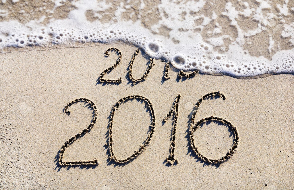 Happy New Year 2016 replace 2015 concept on the sea beach